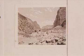 On the beach below Lava Falls after portage. Nevills party of 1947. One of the springs flows off the point at the left. Bright Angel gauge: 18,300 cfs
