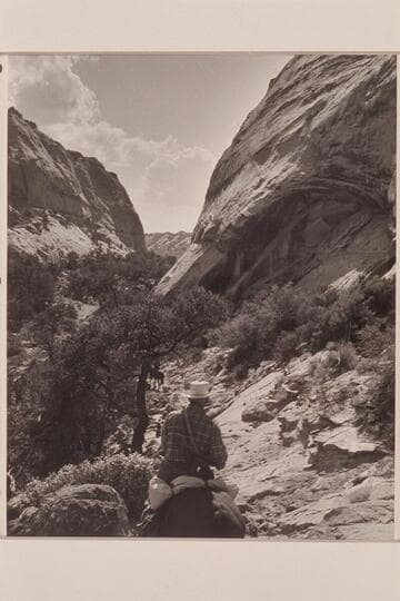 Down the trail from Rainbow Plateau into Navajo Canyon. Masland in foreground