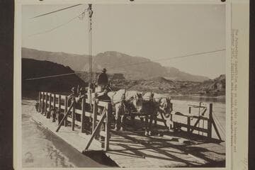 The Pathe-Bray Expedition was on the river in November and December 1927. Supplies were brought in at Lees Ferry and transported across the river in the manner shown here. The man nearest the camera operated the ferry