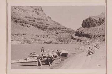 Beached for repairs just above Granite Narrows. John Schulz and Brian Rowlands are seated at right