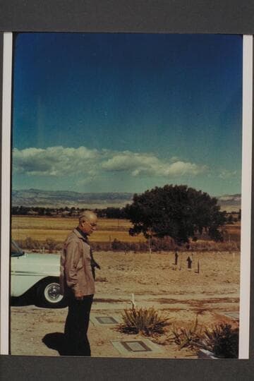 Dock Marston at the grave of Frank V. Goodman. Galloway graves in background. Vernal Cemetery