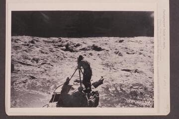 Photographer Tadje at work. Location must be in the section between Lees Ferry and Bright Angel Creek. The boat moored in the foreground is the "Titanic" which was brought in at Hite and lost at Bright Angel Creek or Pipe Creek