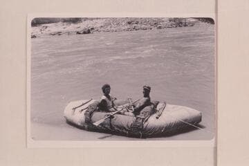 Fern and Bill Davis in their canvas-covered neoprene boat. The inflated craft is 11 1/2 ft. long. Cataract Canyon during run from Flaming Gorge to Bright Angel Creek