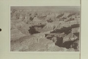 Down the Grand Canyon from Hopi Point. The butte at lower left is The Alligator and at middle left is Cope Butte. Between the two is Monument Creek. Hermit Rapid is in the shadow where the river appears