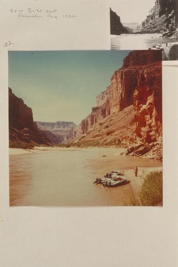 The three aluminum outboard powered boats moored at the Canyon below Kwagunt Rapid. Taylor walks on the beach